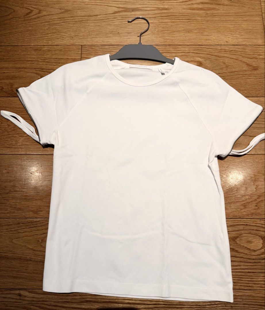 Helmut Lang Zip Sleeve T-Shirt White (Category: Shirts) located in Makati City. Submitted by beehive03 (Listing ID 1467459939, Image 2). Description: Worn once Excellent condition - Brand: Helmut Lang -Fits small to medium (tag size says XL but fits small because it’s a baby tee) - Color: Crisp White - Material: 100% Premium Cotton - Fit: Regular fit with crew neck - Details: Unique zipper accents on short sleeves - Origin: Made in Portugal - Car