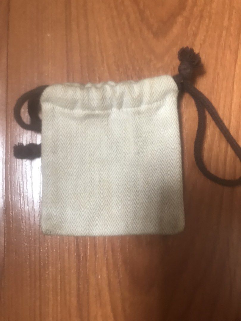 Hermes Dust Bag (Category: Luxury Bags & Wallets) located in Caloocan City. Submitted by prelovebyoreo (Listing ID 1467371217, Image 2). Description: - Authentic small Hermes dust bag made from durable herringbone cotton canvas - Features the signature dark brown equestrian logo on the front - Secure brown drawstring closure with stylish knotted ends - Clean, unlined interior to protect your valuables - Ideal for traveling or storing small jewelr