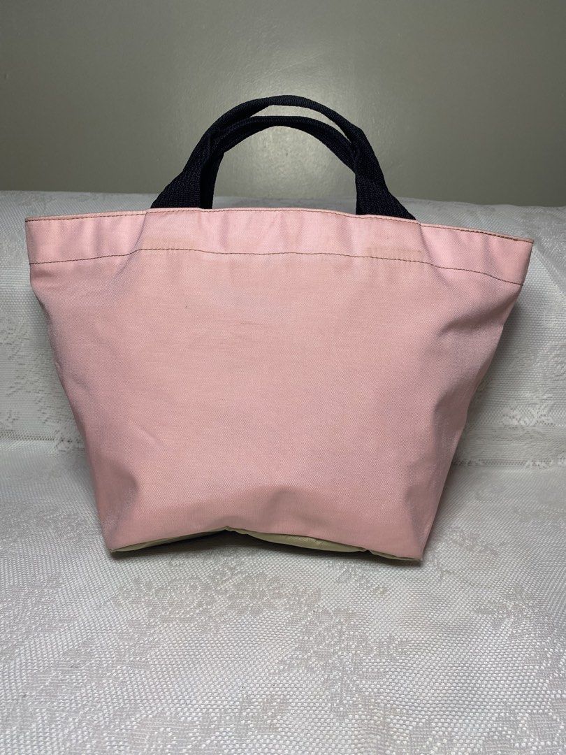 Hervè Chapelier bag (Category: Tote Bags) located in Angeles City. Submitted by noagrace (Listing ID 1467414207, Image 2). Description: Hervé Chapelier Nylon Boat Tote pink nylon fabric and contrasting dark handles Medium size Normal signs of use 850.