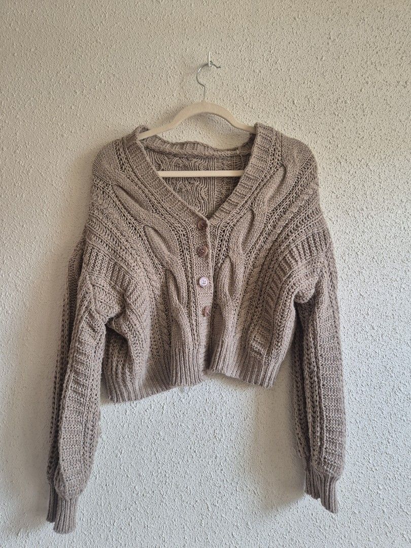 High Quality Knit Cardigan M-L (Category: Coats, Jackets and Outerwear) located in Manila. Submitted by belovedbyjess (Listing ID 1467408455, Image 2). Description: - Color: Versatile mocha brown - Design: Classic cable knit pattern on front and back - Details: Button-down front with matching tortoiseshell buttons - Fit: Relaxed balloon sleeves with comfortable ribbed cuffs - Feel: Heavyweight, premium quality construction - Use: Perfect cozy lay