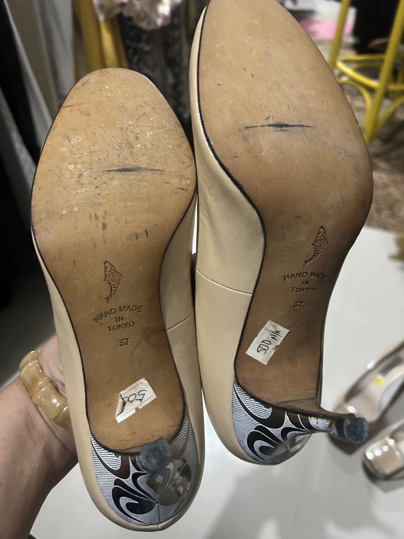 Hio favorites (Category: Heels) located in Cavite. Submitted by cecitrifthshop (Listing ID 1467472893, Image 3). Description: a pair of classic beige high-heel pumps with gold script branding on the insole. Hio favorites size 37 made in tokyo.