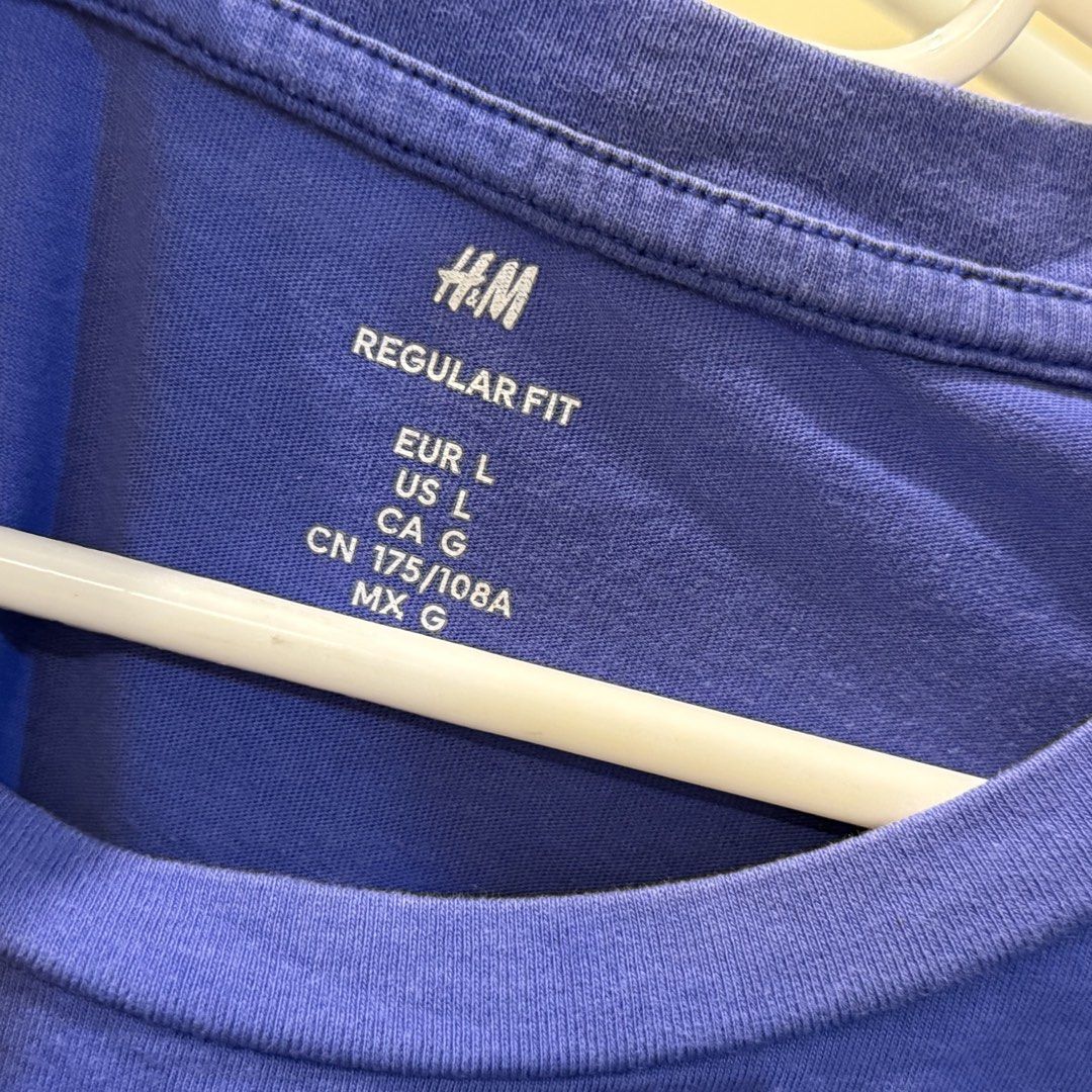 H&M Blue Regular Fit T-Shirt Size L (Category: Tshirts & Polo Shirts ) located in Marikina City. Submitted by lovegoeson (Listing ID 1467531029, Image 2). Description: - Brand: H&M - Color: Solid Blue - Size: L (EUR/US/CN 175/108A) - Fit: Regular fit with standard crew neckline and short sleeves - Style: Simple basic piece, perfect for everyday casual wear and easy to match with jeans or shorts.