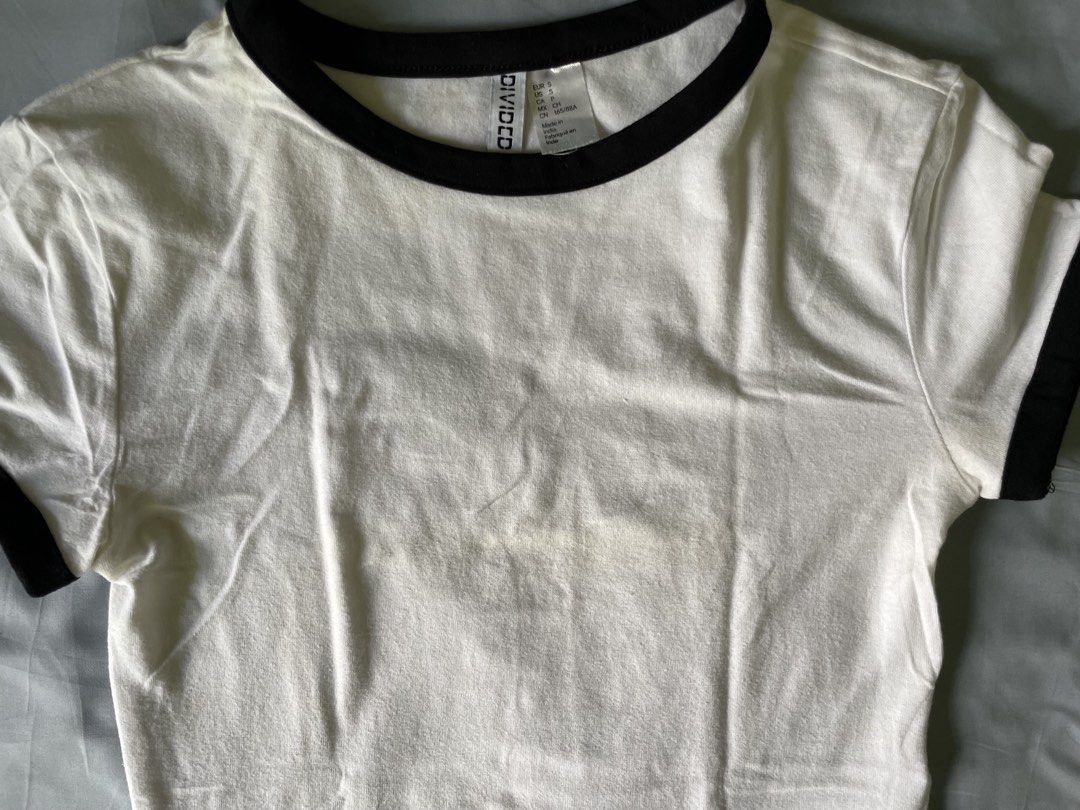 H&M Divided White and Black Ringer T-Shirts Bundle (Category: Shirts) located in Naga. Submitted by threads_and_treats92 (Listing ID 1467390504, Image 3). Description: - Brand: H&M Divided - Size: S - Set includes: 1 plain white t-shirt and 1 white ringer tee with black contrast trim (₱200 for both) - Condition: Great shape with clear tags attached inside the collar *3rd photo: Washable yellowish stain.