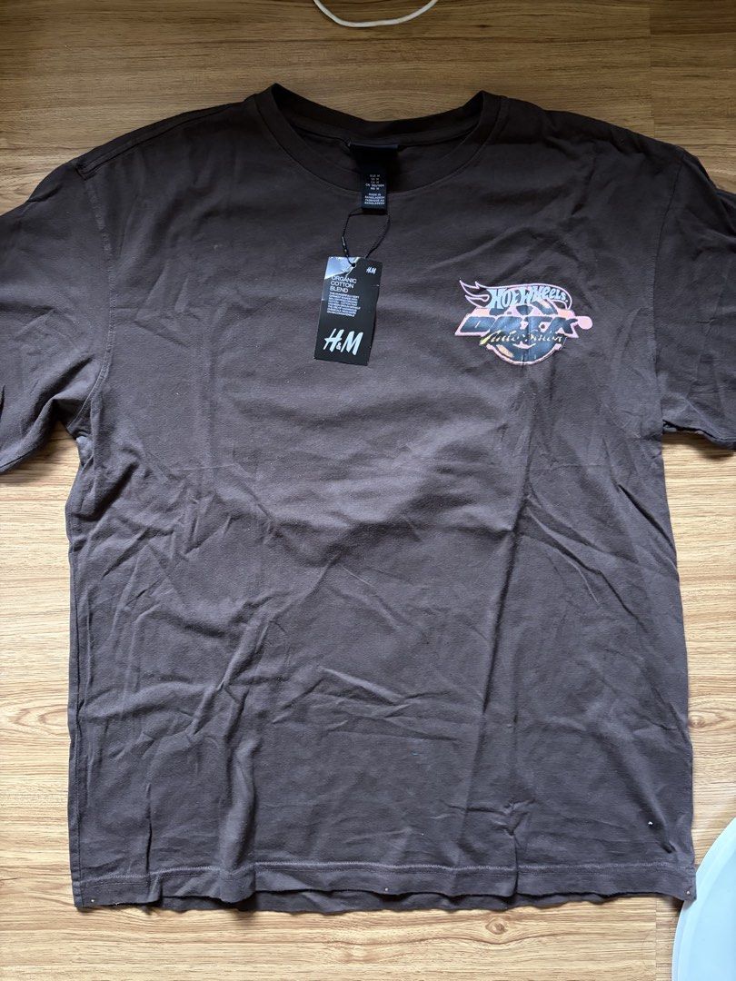 H&M x DBTK SHIRT (Category: Tshirts & Polo Shirts ) located in San Pedro. Submitted by nikkiabc.777 (Listing ID 1467392159, Image 1). Description: H&M x DBTK SHIRT - color: brown - brandnew; with tag - size: medium - can be unisex .