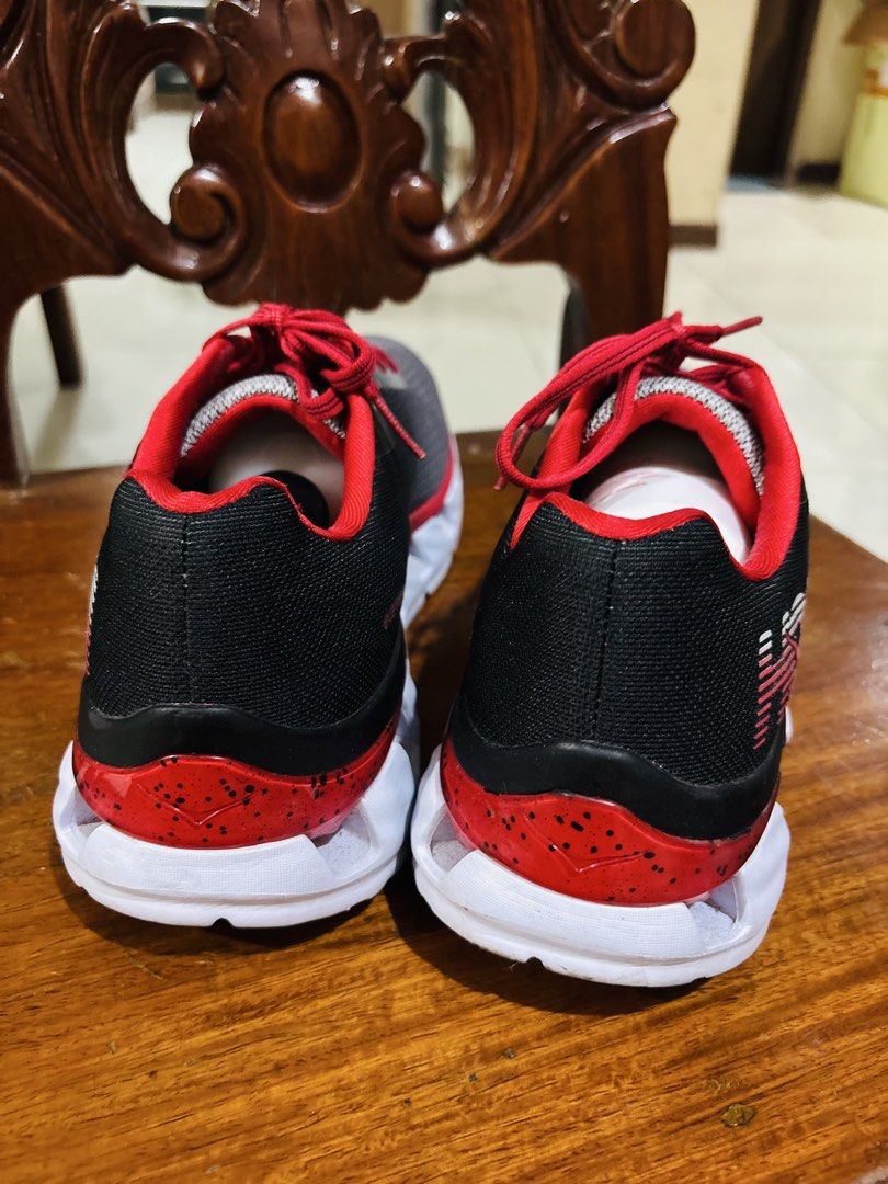 Hoka Elevon Running Shoes Grey Black Red (Category: Sneakers) located in Marikina City. Submitted by tracykrystlem (Listing ID 1467404725, Image 3). Description: - Brand: Hoka - Model: Elevon - Colorway: Grey mesh upper transitioning to black, with vibrant red laces and inner lining - Sole: White ProFly midsole with speckled red heel detail and black outsole - Features: Breathable perforated toe box, lightweight athletic build, signature Hoka sid