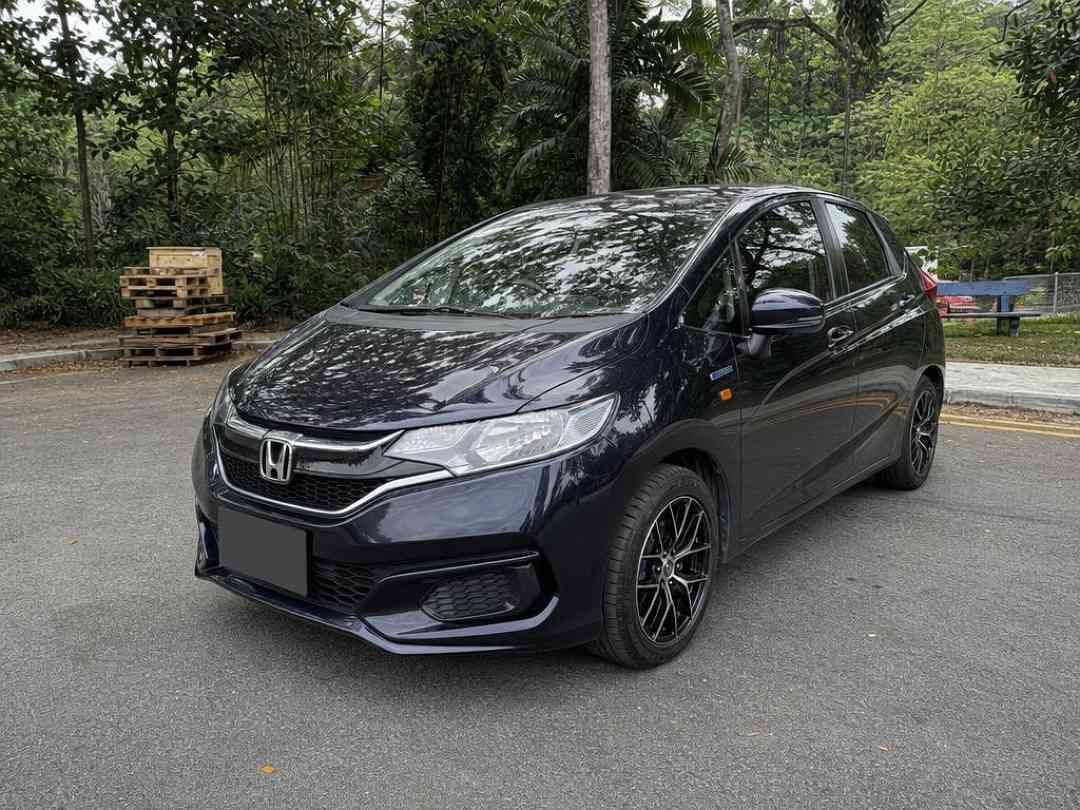 Honda Fit Hybrid 1.5 [2017 FL] (A) (Category: Used Cars) located in Singapore. Submitted by carousell_certified_partners (Listing ID 1467532864, Image 1). Description: Lowest price in the market! No gimmick, available for immediate viewing and driveaway. NOT consignment unit. Superb fuel efficient over 20km/l. Compact and sporty looking hatchback. Highly flexible seat arrangement. Huge boot space despite its look. Contact us to view today! Featur