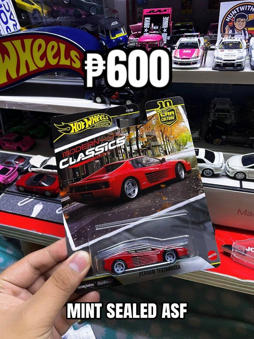 Hot Wheels Premium Modern Classics Ferrari Testarossa (Category: Vehicle & Diecast Models) located in Quezon City. Submitted by huntwithnyx (Listing ID 1467387698, Image 1). Description: - Brand: Hot Wheels Premium Modern Classics - Model: Ferrari Testarossa (Red) - Condition: Brand new, carded, never opened - Features: Real Riders rubber tires & metal-on-metal body - Packaging: Clean card art featuring a street scene background - Ideal for: Ferr