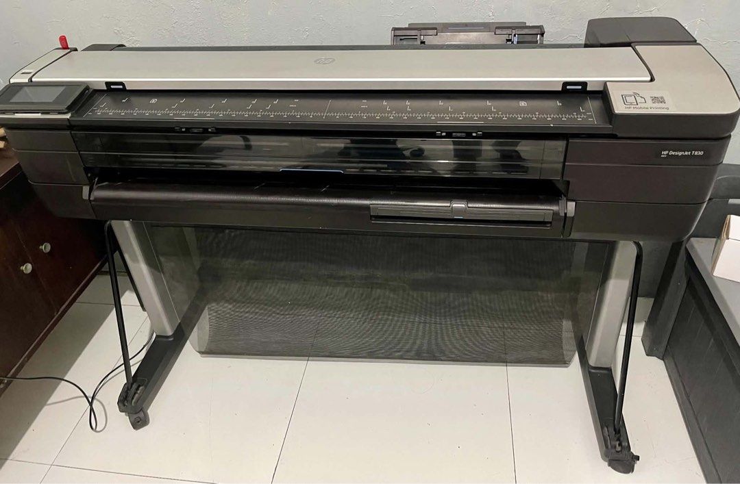 HP DesignJet T830 Large Format Plotter Printer 36" (Category: Printers, Scanners & Copiers) located in Manila. Submitted by niemaedc (Listing ID 1467421367, Image 1). Description: - Model: HP DesignJet T830 Wide Format Printer - Features: Built-in scanner module and touch screen control panel - Connectivity: Mobile printing enabled - Extras: Includes integrated stand, catch basket, heavy-duty wheels, and standard power cable - Condition: Clean un