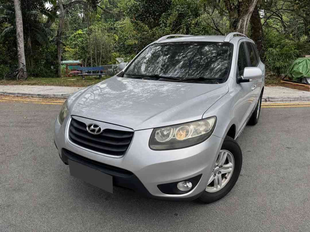Hyundai Santa Fe 2.4 GLS (A) (Category: Used Cars) located in Singapore. Submitted by carousell_certified_partners (Listing ID 1467532278, Image 1). Description: Well-maintained Condition! Comfortable and practical SUV experience. Spacious cabin with generous boot space. Regularly serviced & Ready to Go Condition. Flexible bank & in-house loan available! Trade in Available! Call to make appointment now! Features: 2.4L petrol engine with automatic