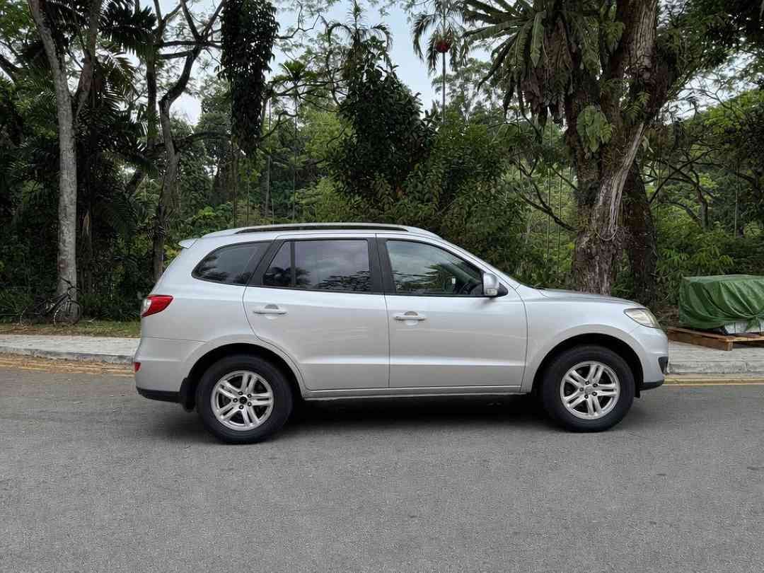 Hyundai Santa Fe 2.4 GLS (A) (Category: Used Cars) located in Singapore. Submitted by carousell_certified_partners (Listing ID 1467532278, Image 2). Description: Well-maintained Condition! Comfortable and practical SUV experience. Spacious cabin with generous boot space. Regularly serviced & Ready to Go Condition. Flexible bank & in-house loan available! Trade in Available! Call to make appointment now! Features: 2.4L petrol engine with automatic