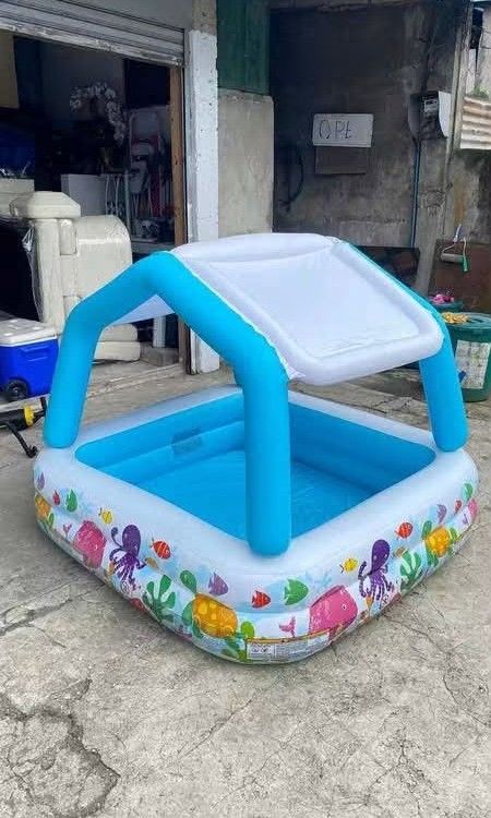 INTEX DURABLE FAMILY SPLASH POOL WITH SUNSHADE CANOPY (Category: Other Babies Going Out Needs) located in Sablan. Submitted by gongonshelley12 (Listing ID 1467404349, Image 3). Description: 🏖️💦 INTEX DURABLE FAMILY SPLASH POOL WITH SUNSHADE CANOPY ✅ COLORFUL OCEAN DESIGN ✅ BUILT-IN SUNSHADE CANOPY PARA PROTECTION SA INIT NG ARAW ✅ HEAVY-DUTY MATERIAL — MATIBAY AT SAFE PARA SA MGA BATA ✅ EASY TO SET UP AND STORE — INFLATABLE DESIGN!📏 SIZE: 62” 