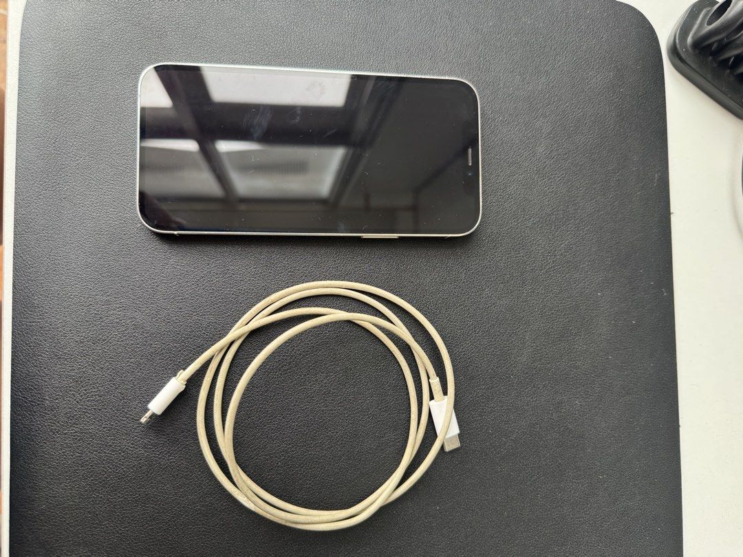 Iphone 12 Pro (Category: iPhone 12 Series) located in Antipolo. Submitted by closet.cleanup (Listing ID 1467383345, Image 3). Description: - Model: Apple iPhone 12 Pro - Color: White - Condition: Working condition with clean screen and back glass; visible scuffs and signs of wear on the stainless steel side frame - Comes with a charging cable - no more box - female owned.