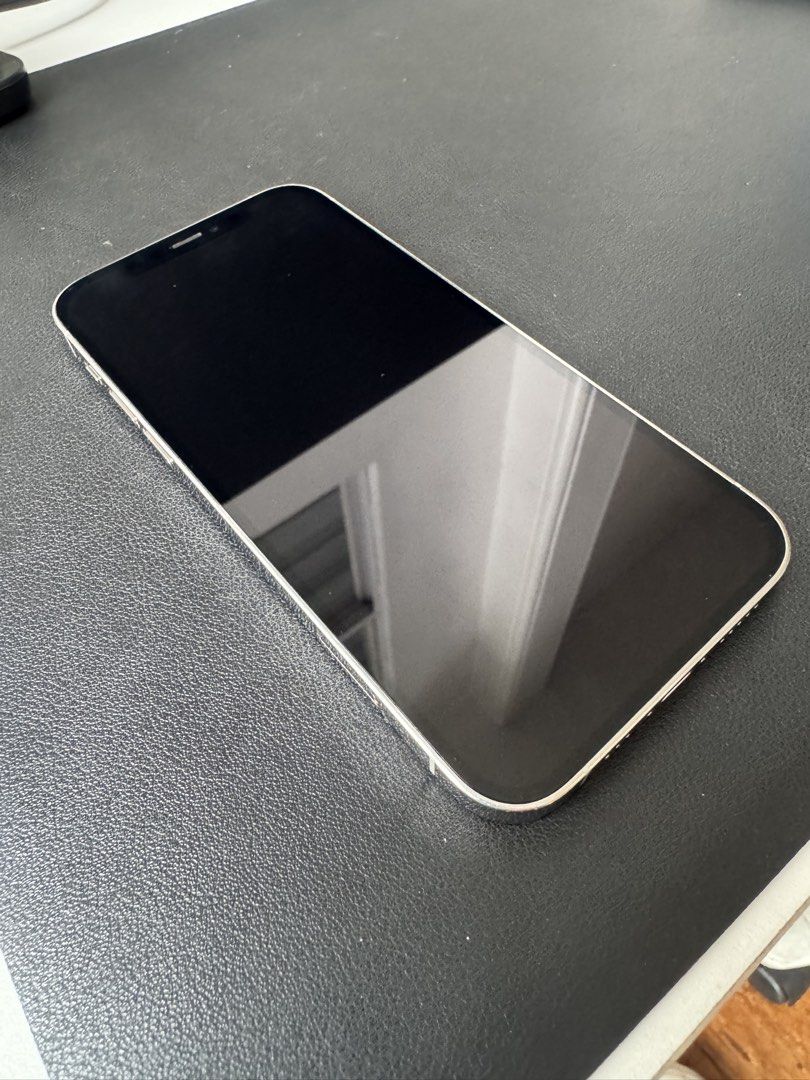 Iphone 12 Pro (Category: iPhone 12 Series) located in Antipolo. Submitted by closet.cleanup (Listing ID 1467383345, Image 2). Description: - Model: Apple iPhone 12 Pro - Color: White - Condition: Working condition with clean screen and back glass; visible scuffs and signs of wear on the stainless steel side frame - Comes with a charging cable - no more box - female owned.