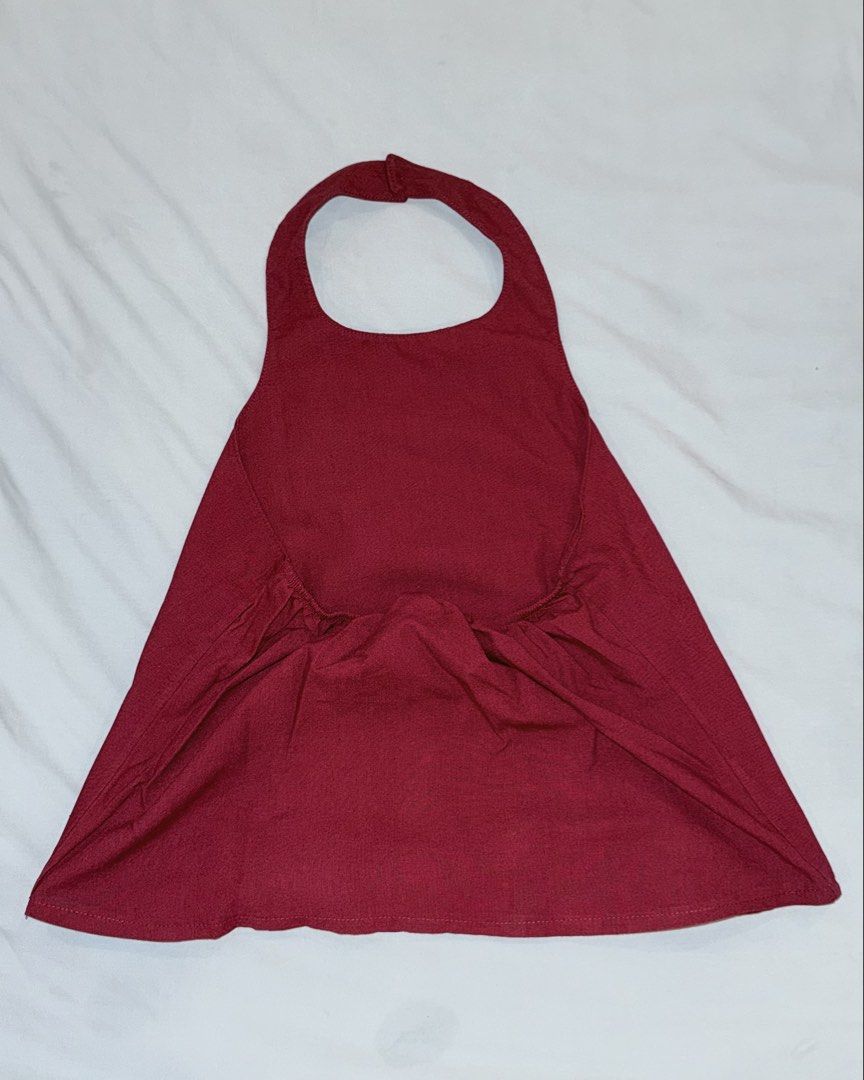 ISAY Maroon Halter Top Cotton Linen (Category: Sleeveless) located in Las Pinas. Submitted by kathhsantoss (Listing ID 1467480540, Image 2). Description: - Used only once - Measurements: Width: 15-18in Length: 16in - Material: Breathable cotton linen fabric - Design: Halter top with button closure at the neck - Fit: Garterized back for added comfort with a flare style body.