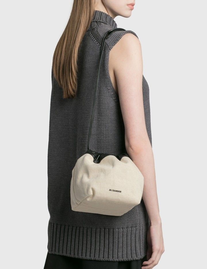 JIL SANDER - Drawstring Crossbody Bag (Category: Cross-body Bags) located in Manila. Submitted by espesyaloffer (Listing ID 1467363857, Image 1). Description: JIL SANDER - Drawstring Crossbody Bag Condition : 9/10 Dimensions ⬇️ Width : Length : Height : Flaws : dirt, stains and minor yellowing P2,880 + sf.