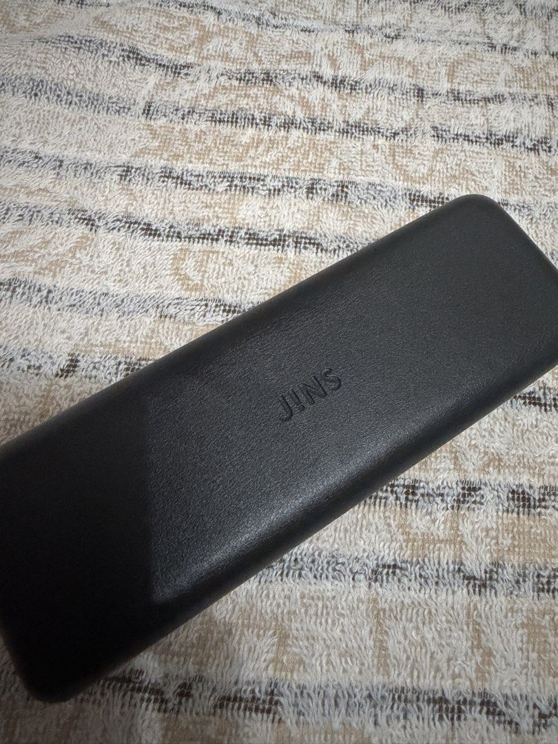JINS Airframe Square Black Glasses with Case and Cloth (Category: Sunglasses & Eyewear) located in Pasig City. Submitted by jjj_26 (Listing ID 1467484486, Image 2). Description: - Brand: JINS - Style: Black rectangular frame - Fit: Lightweight build with adjustable nose pads for comfort - Inclusions: Matching hard case and cleaning cloth included - Lenses: Fitted with clean lenses; ready for your own prescription at any optical shop - Condition: 