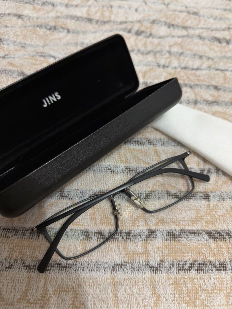JINS Airframe Square Black Glasses with Case and Cloth (Category: Sunglasses & Eyewear) located in Pasig City. Submitted by jjj_26 (Listing ID 1467484486, Image 1). Description: - Brand: JINS - Style: Black rectangular frame - Fit: Lightweight build with adjustable nose pads for comfort - Inclusions: Matching hard case and cleaning cloth included - Lenses: Fitted with clean lenses; ready for your own prescription at any optical shop - Condition: 