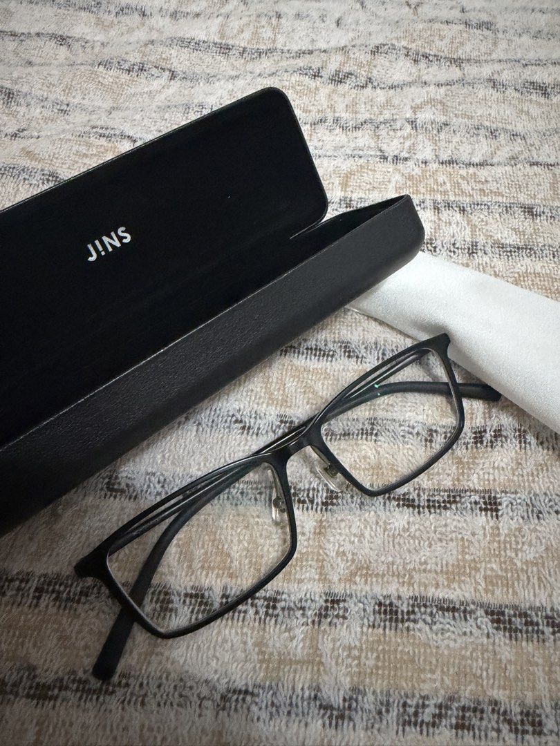 JINS Airframe Square Black Glasses with Case and Cloth (Category: Sunglasses & Eyewear) located in Pasig City. Submitted by jjj_26 (Listing ID 1467484486, Image 3). Description: - Brand: JINS - Style: Black rectangular frame - Fit: Lightweight build with adjustable nose pads for comfort - Inclusions: Matching hard case and cleaning cloth included - Lenses: Fitted with clean lenses; ready for your own prescription at any optical shop - Condition: 
