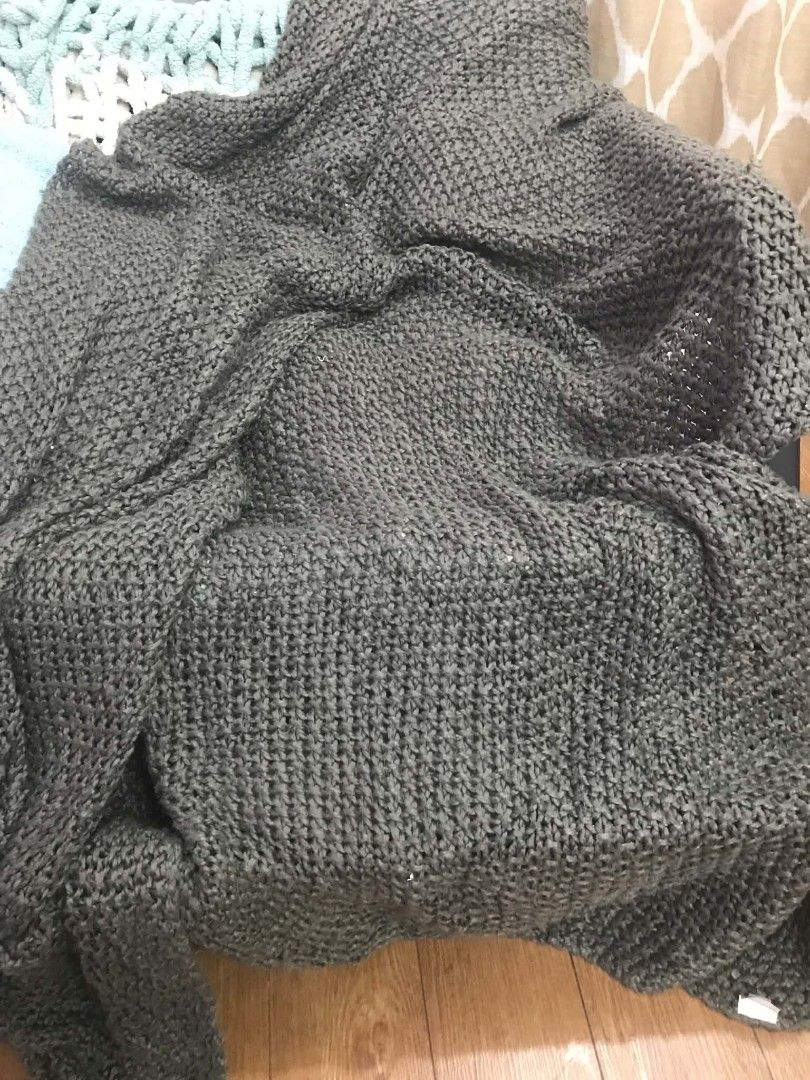 John Lewis Dark Grey Chunky Knit Throw Blanket (Category: Bedding & Towels) located in Imus. Submitted by stop_shop7 (Listing ID 1467419407, Image 3). Description: - Brand/Item: John Lewis dark grey chunky knit throw blanket - Texture: Thick, textured yarn woven throughout for a cozy look - Color: Neutral solid dark grey, fits any living room or bedroom decor - Comfort: Heavyweight style designed to keep you warm on cold nights - Condition: Clean