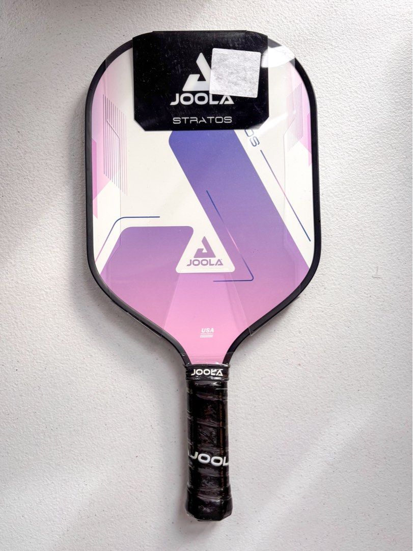 JOOLA Stratos Lavender Pickleball Paddle (Category: Racket and Ball Sports) located in Bacolor. Submitted by tishfinds_ (Listing ID 1467364227, Image 1). Description: - Brand: JOOLA Stratos - Color: Lavender - Condition: Brand new, unused with factory plastic wrap on face and handle - Core Thickness: 10mm - Dimensions: 16" length x 7.875" width - Grip: 5" length, 4" circumference - Weight: Approx. 8 oz.