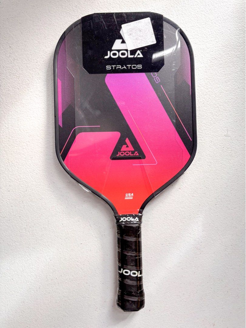 Joola Stratos Pink Pickleball Paddle (Category: Racket and Ball Sports) located in Bacolor. Submitted by tishfinds_ (Listing ID 1467364256, Image 1). Description: Bought in the US. - Brand: Joola Stratos Pink (10mm) - Condition: Brand new, unopened with plastic wrap and packaging intact - Dimensions: 16" length x 7.875" width - Weight: Avg. 8 oz - Grip: 5" length, 4" circumference - Certification: USA Pickleball approved - Authenticity: Original 
