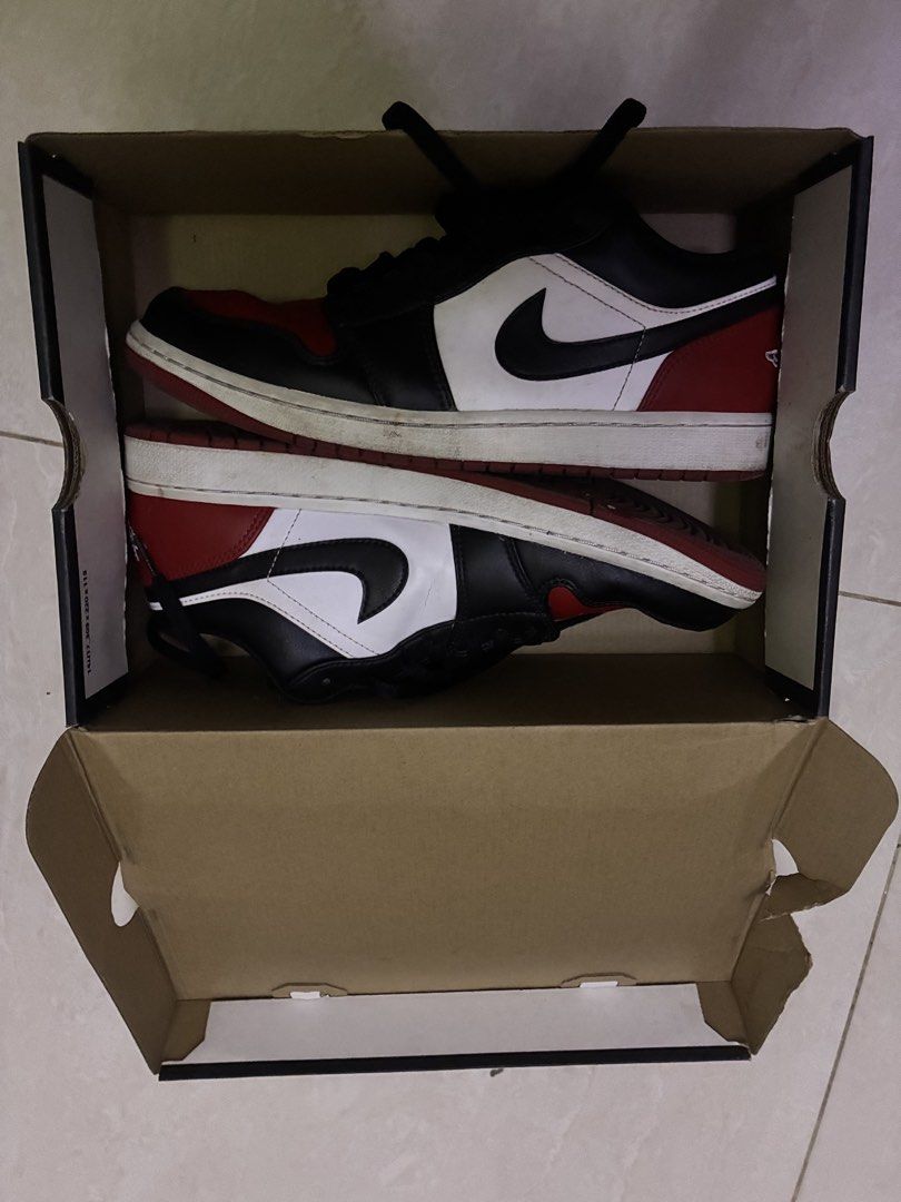 Jordan 1 Low "Bred Toe" 2.0 (2023) (Category: Sneakers) located in Manila. Submitted by marcraphael (Listing ID 1467423476, Image 2). Description: With box Need cleaning lang onti Unli check 100% original Still negotiable Rfs: need funds Issue: medyo nabura lang onti yung brand sa apakan sa loob ng sapatos kakagamit Size 10 US Size 9 UK Loc: mnl/pasay/makati for meet ups Can do lalamove (cod/cop).