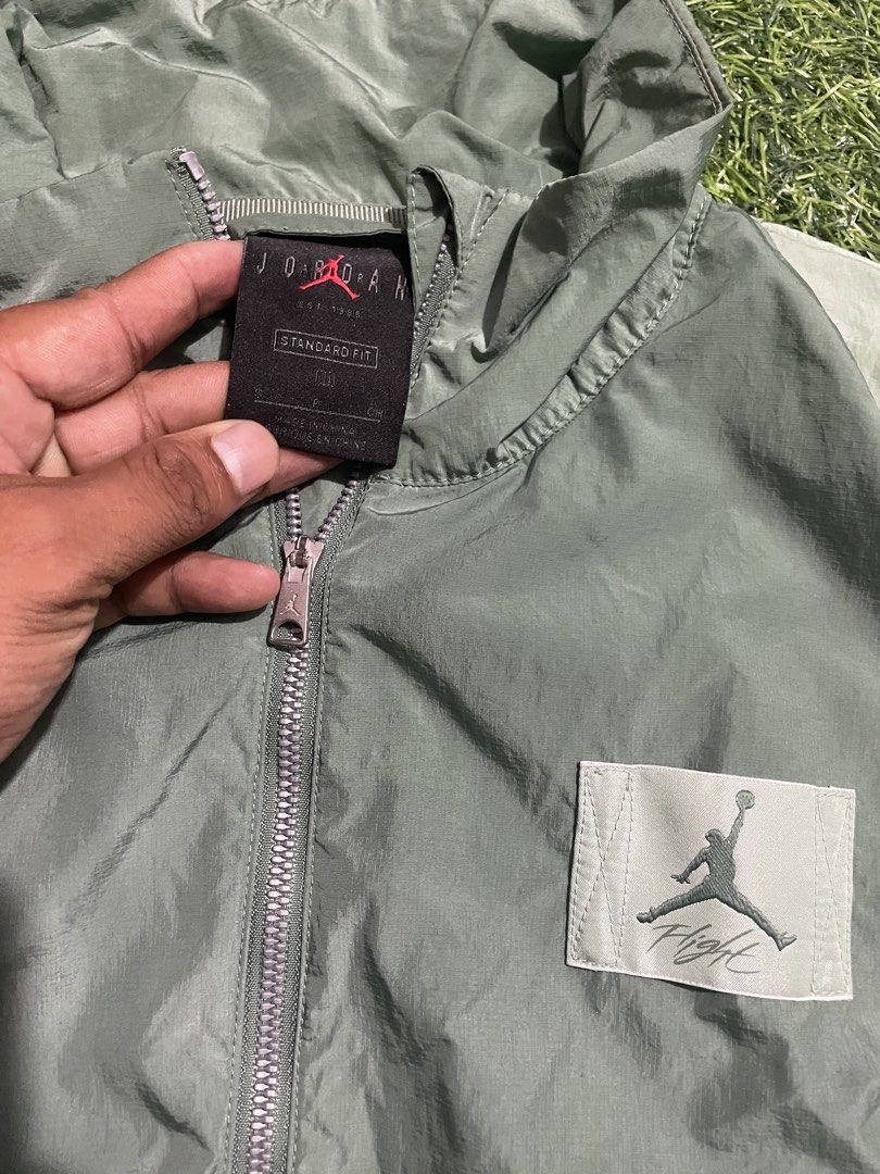 Jordan Flight Green Nylon Tracksuit Set (Category: Activewear) located in Las Pinas. Submitted by jynxdefant26140 (Listing ID 1467519156, Image 3). Description: - Authentic Jordan Flight tracksuit - Colorway: Sage green and light green - Size: Small (tag attached) - Material: Lightweight crinkle nylon - Jacket features: Full zip closure, stand collar, and elastic cuffs - Pants features: Elastic waistband with drawstrings and convenient side pocke