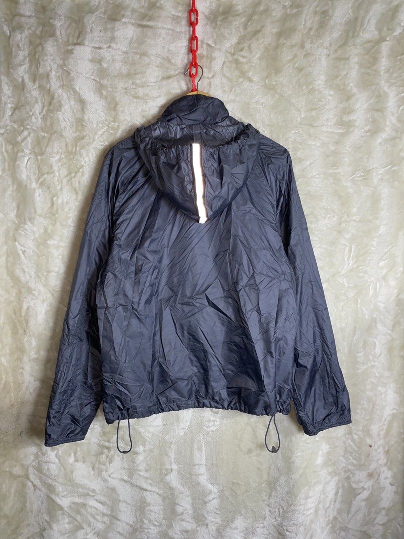 Jordan Jumpman Gray Hooded Windbreaker Jacket Size S (Category: Coats, Jackets and Outerwear) located in Molave. Submitted by charlesthrifter (Listing ID 1467366751, Image 2). Description: - Authentic Jordan windbreaker jacket in size Small - Stylish gray body with an embroidered purple Jumpman logo on the sleeve - Functional hood with a reflective strip down the back for visibility - Breathable printed mesh interior lining - Full zipper closure 