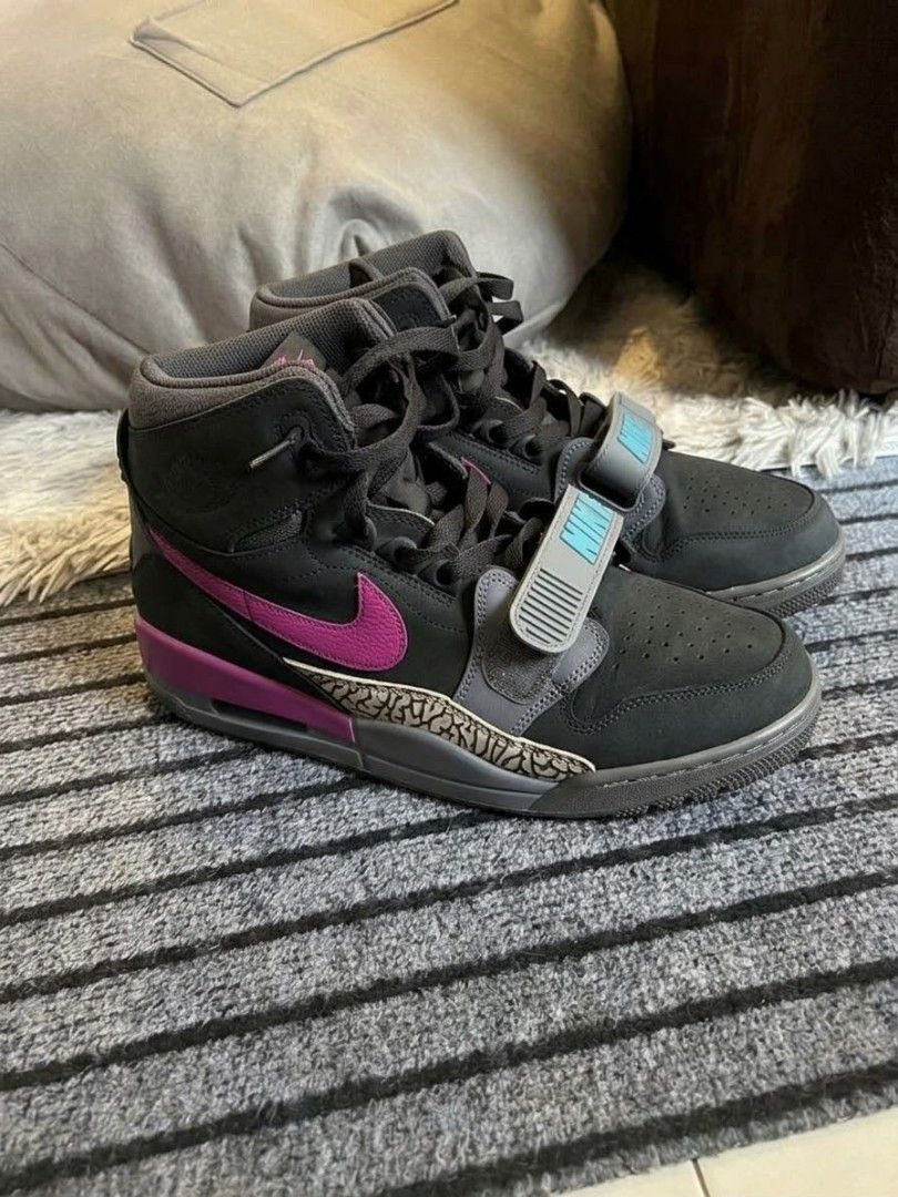 Jordan Legacy 312 AV3922-005 Size 10.5 (Category: Sneakers) located in Mandaluyong City. Submitted by bethco (Listing ID 1467545501, Image 1). Description: - Brand/Model: Jordan Legacy 312 High - Colorway: Black, purple, and grey with iconic elephant print overlays - Highlights: Midfoot strap with turquoise Nike branding and visible Air unit in the heel - Size: US 10.5 / UK 9.5 / EUR 44.5 - Condition: Clean soles and uppers, ready to wear.