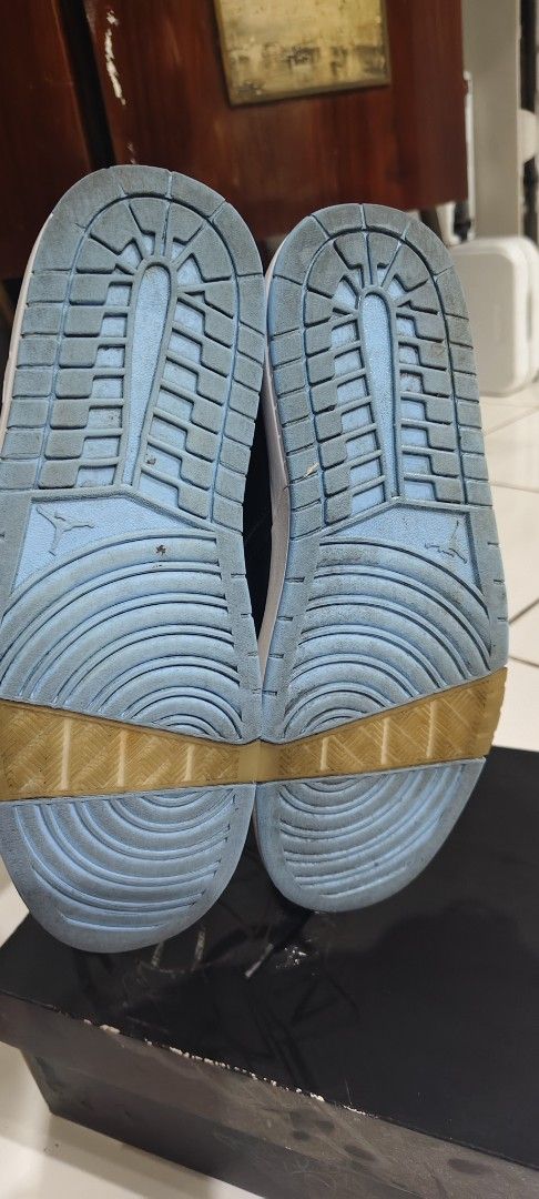 Jordan Nu Retro 1 Low Black University Blue (Category: Sneakers) located in Las Pinas. Submitted by jonjaymanese20 (Listing ID 1467452887, Image 2). Description: - Model: Jordan Nu Retro 1 Low - Colorway: Black and University Blue - Size: US 9.5 - Inclusions: Original box included - Design: Classic low top with debossed Air Jordan branding and striking patent blue toe boxes and heel panels - Condition: Soles show minor wear with slight yellowing 