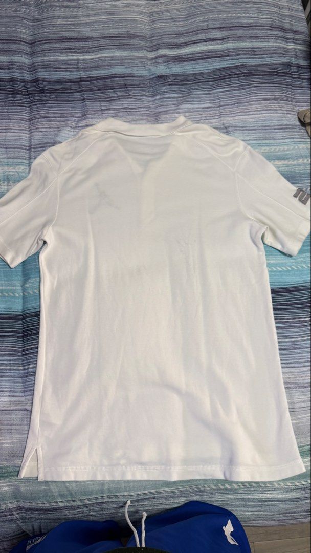 Jordan White Polo Shirt Size XL (Category: Tshirts & Polo Shirts ) located in Quezon City. Submitted by kobeeeee_12 (Listing ID 1467514621, Image 2). Description: - Brand: Jordan - Color: White - Size: XL - Material: 100% Cotton - Design: Classic collar with front button placket - Details: Signature Jumpman logo on the left chest and unique number detail on the sleeve - Condition: Brand new with tags - Care instructions included on the inner tag.
