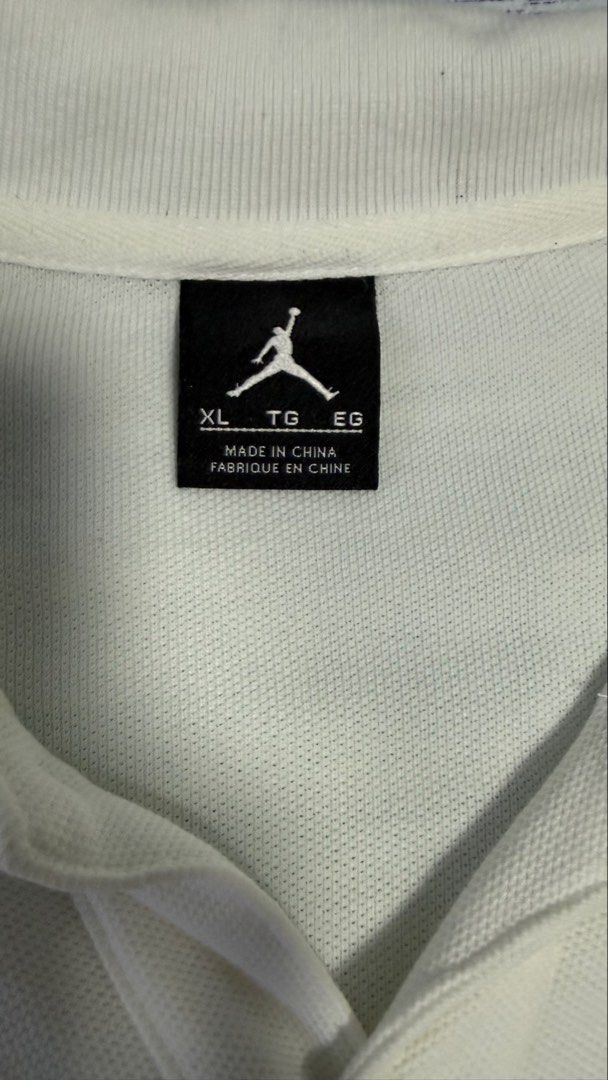 Jordan White Polo Shirt Size XL (Category: Tshirts & Polo Shirts ) located in Quezon City. Submitted by kobeeeee_12 (Listing ID 1467514621, Image 3). Description: - Brand: Jordan - Color: White - Size: XL - Material: 100% Cotton - Design: Classic collar with front button placket - Details: Signature Jumpman logo on the left chest and unique number detail on the sleeve - Condition: Brand new with tags - Care instructions included on the inner tag.