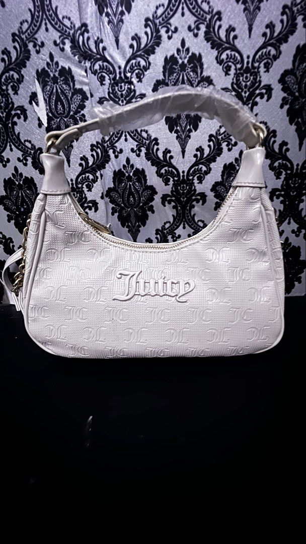 Juicy Couture White Monogram Shoulder Bag (Category: Shoulder Bags) located in Bulacan. Submitted by darkside_apparel (Listing ID 1467469574, Image 1). Description: WHITE JUICY COUTURE CROSS BODY BAG M: 1200 Mine now pay later No cancellation No Return N Refund Reminder: We are not liable on any lost or damage of parcel..