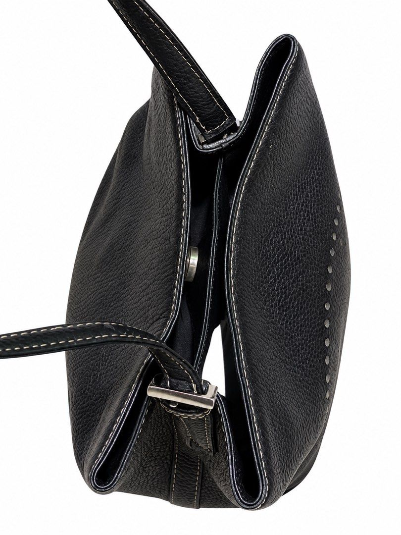 Juno black textured leather shoulder bag with perforated H pattern (Category: Shoulder Bags) located in Carigara. Submitted by spark2503 (Listing ID 1467382212, Image 3). Description: - Brand: Juno - Material: Black textured leather with silver-tone hardware - Design: Perforated H pattern on the front and unique side strap buckles - Interior: Double compartment layout with a middle zippered pocket and a small gold-tone brand plate - Lining: Clean
