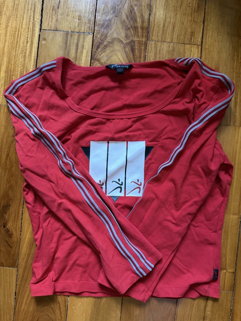 K Active Red Long Sleeve Top with Striped Sleeves (Category: Longsleeves) located in Manila. Submitted by cleverfox.a30bf1 (Listing ID 1467425426, Image 1). Description: - Brand: K Active - Size: L - Color: Red - Material: Soft cotton - Features: Striped detailing on both sleeves and chest graphic print with white abstract panels - Condition: Great for everyday casual wear.