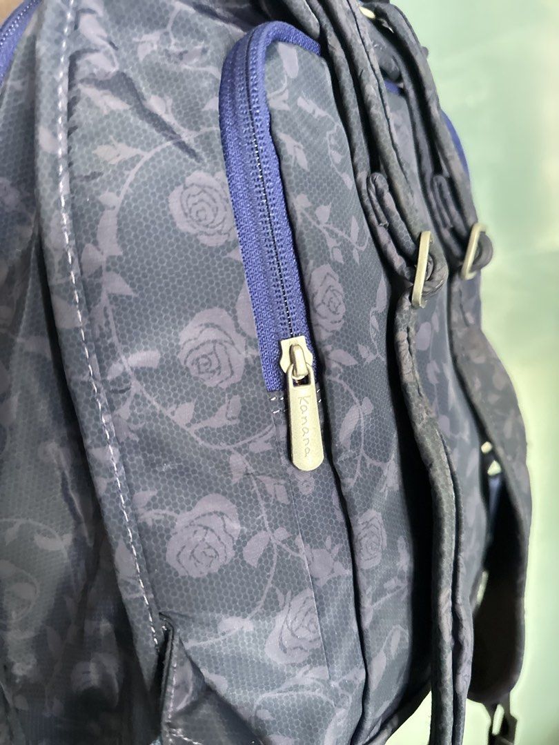 Kanana Project Blue Rose Pattern Backpack (Category: Backpacks) located in Mandaluyong City. Submitted by TheWeekendProject (Listing ID 1467421682, Image 3). Description: - Color & Design: Navy blue with an all-over rose and lace pattern and metallic silver trim - Interior: Vibrant pink lining with convenient slip pockets - Storage: Double zipper main compartment and a front zip pocket - Comfort & Carry: Top grab handle and adjustable shoulder st