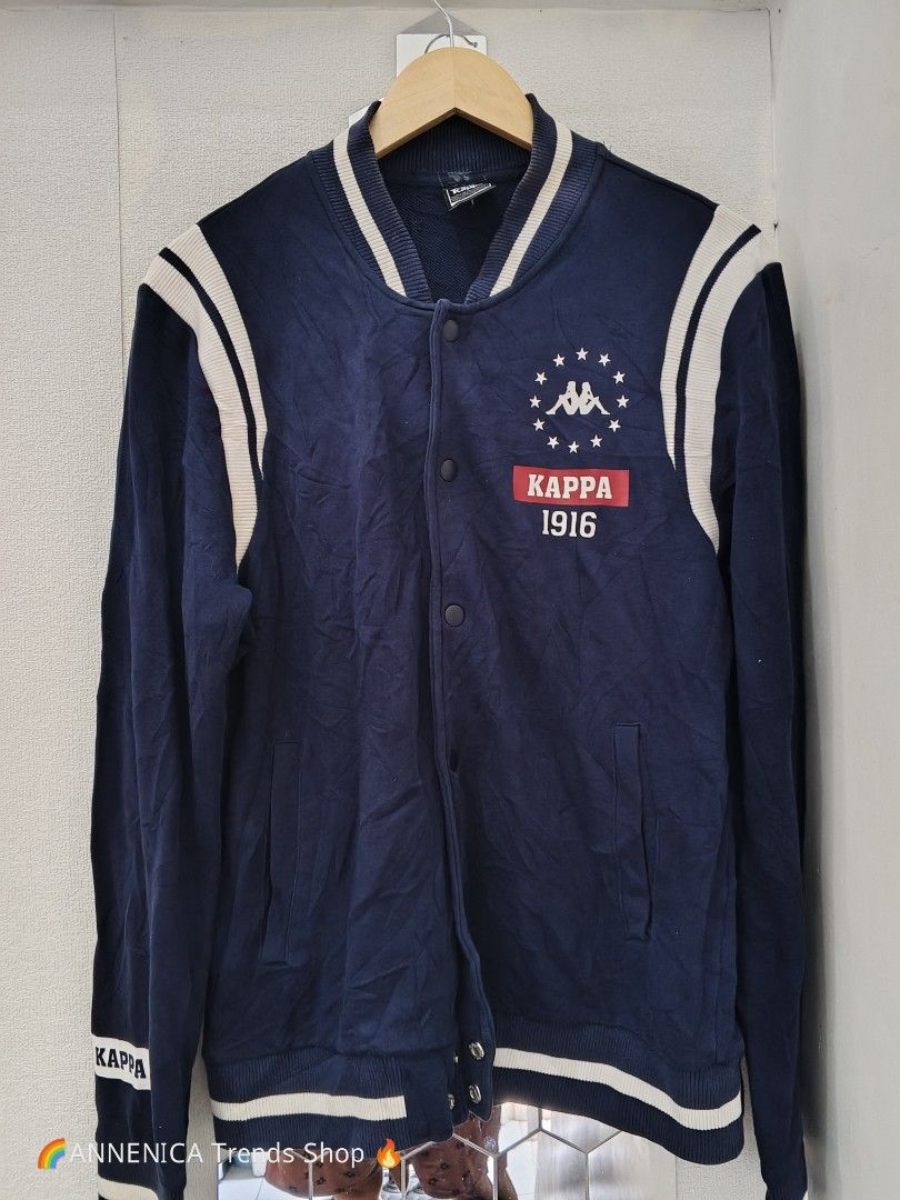 KAPPA 1916 Varsity Bomber Jacket (Category: Coats, Jackets and Outerwear) located in Bulacan. Submitted by annenicathriftthriftlang (Listing ID 1467429893, Image 2). Description: KAPPA 1916 Varsity Bomber Jacket - Navy Blue - Unisex 📏 DIMES: Tag Size: KAPPA (Born in Italy) - Best fit M-L Pit to Pit: 22-23 inches Length: 26-27 inches Sleeve: 25-26 inches Shoulder: 19 inches 📝 DETAILS: - Brand: KAPPA - BORN IN ITALY (1916) - Color: Navy Blue with