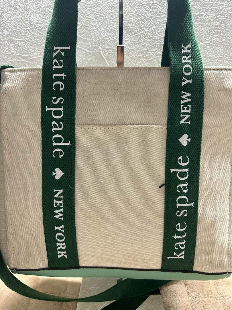 KATE SPADE 2 WAY CANVASS BAG (Category: Cross-body Bags) located in Caloocan City. Submitted by j3ngsanity (Listing ID 1467470629, Image 3). Description: ISSUE : 1 SUPER MINIMAL SCRATCH / NEED CLEANING.