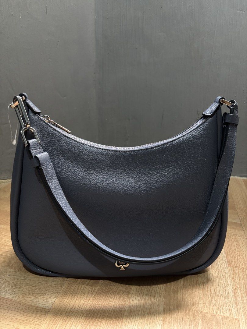 Kate Spade kayla shoulder bag (Category: Luxury Bags & Wallets) located in Santa Rosa. Submitted by rjplpreloved (Listing ID 1467420135, Image 2). Description: - Brand: Kate Spade with tag - Material: pebbled leather twilight color - Hardware: Silver-tone with front spade logo - Closure: Secure zip-top closure - Interior: Dark fabric lining with spade jacquard pattern and a handy zipper pocket -mop gcash, maya -shipping j&t or lalamove .