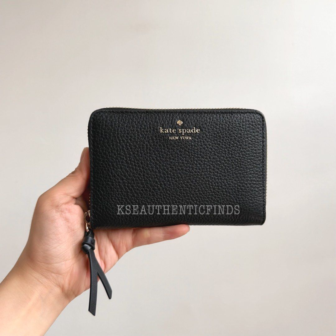 KATE SPADE Knott Medium Bifold Wallet in Black 🇨🇦 (Category: Wallets & Card holders) located in Pasig City. Submitted by kseauthenticfinds (Listing ID 1467446267, Image 2). Description: 𝗡𝗲𝘄 𝗔𝗿𝗿𝗶𝘃𝗮𝗹✨ Knott Medium Bifold Wallet in Black 🇨🇦 with tag only Pasig/Cainta on hand Product details pebbled leather 2 way script logo argento hardware interior ID window, 2 slip pockets, zip pocket, bill slot 6 interior credit card slots zip closu