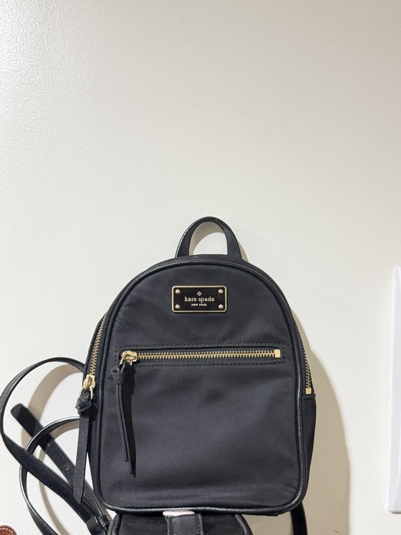 Kate Spade New York black nylon mini backpack (Category: Backpacks) located in Manila. Submitted by ktyyycloset (Listing ID 1467445225, Image 2). Description: - Brand: Kate Spade - Material: Durable black nylon with chic gold hardware - Features: Front zip pocket, adjustable straps, and compact size ideal for daily essentials - Style: Classic, minimalist design that easily matches any outfit -Last price 1,250.