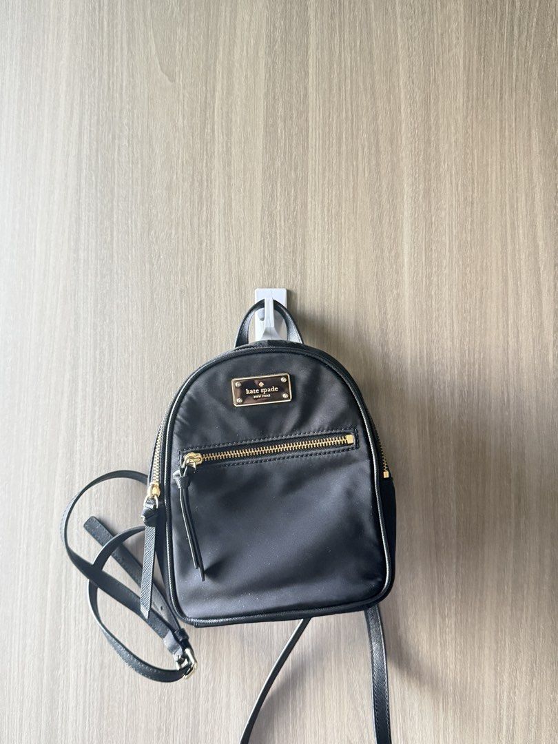 Kate Spade New York black nylon mini backpack (Category: Backpacks) located in Manila. Submitted by ktyyycloset (Listing ID 1467445225, Image 1). Description: - Brand: Kate Spade - Material: Durable black nylon with chic gold hardware - Features: Front zip pocket, adjustable straps, and compact size ideal for daily essentials - Style: Classic, minimalist design that easily matches any outfit -Last price 1,250.