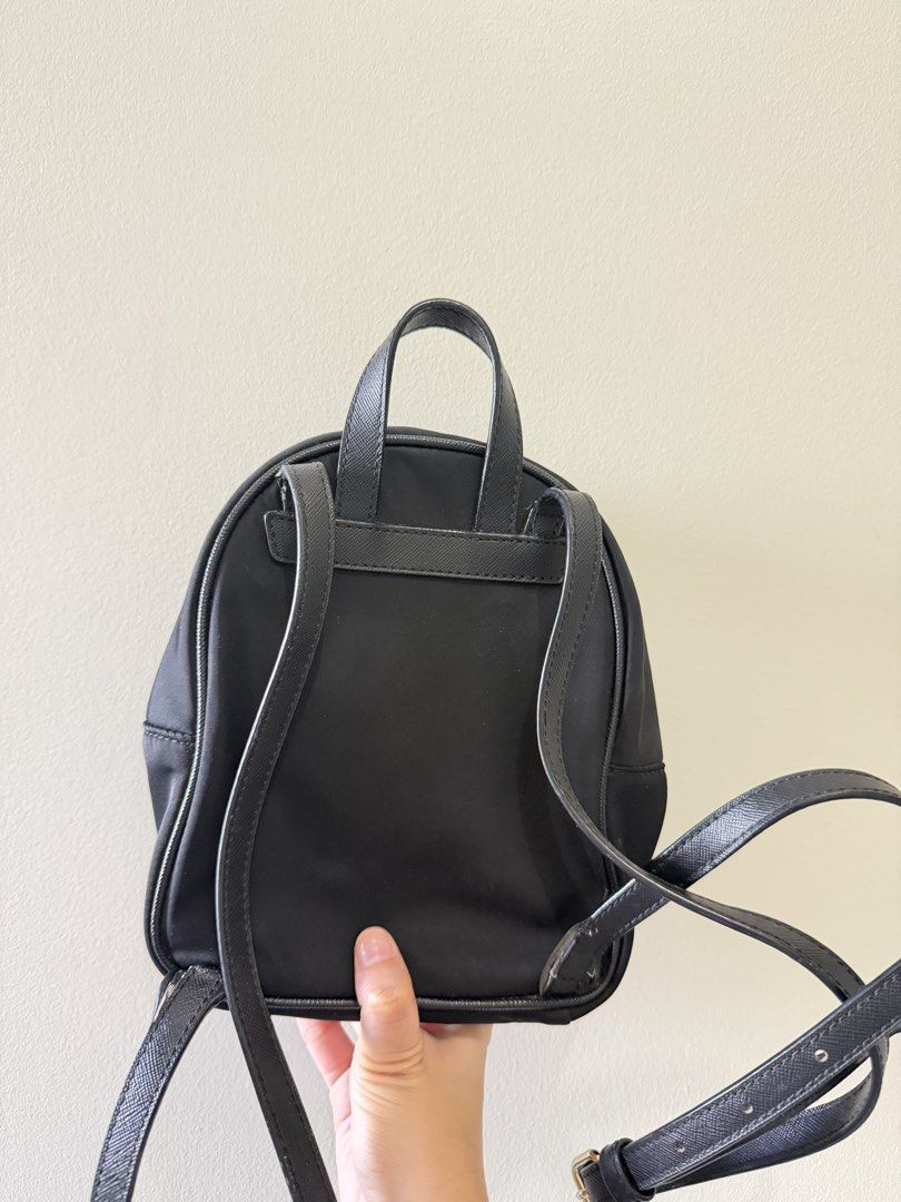 Kate Spade New York black nylon mini backpack (Category: Backpacks) located in Manila. Submitted by ktyyycloset (Listing ID 1467445225, Image 3). Description: - Brand: Kate Spade - Material: Durable black nylon with chic gold hardware - Features: Front zip pocket, adjustable straps, and compact size ideal for daily essentials - Style: Classic, minimalist design that easily matches any outfit -Last price 1,250.