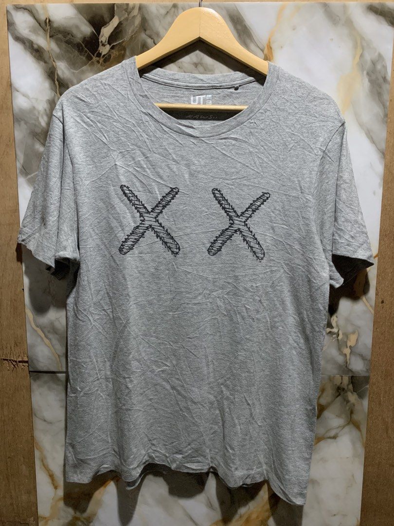 Kaws x Uniqlo (Category: Tshirts & Polo Shirts ) located in Cebu City. Submitted by lk.thrifts (Listing ID 1467588108, Image 2). Description: Kwas x Uniqlo 9/10 color rate Medium on tag W:20 L:27 300 + sf Cebu loc.
