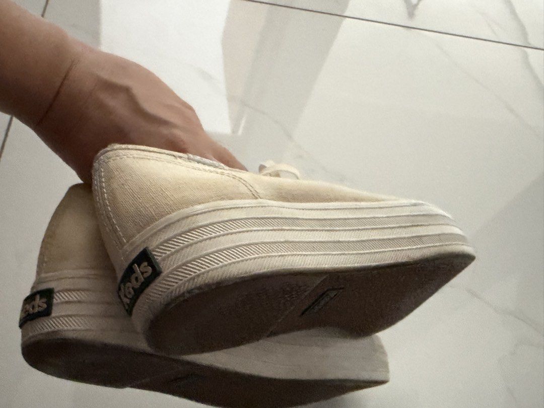 Keds Canvas Platform Sneakers Cream (Category: Sneakers) located in Pasig City. Submitted by vastpenguin.796589 (Listing ID 1467600968, Image 3). Description: - Brand/Style: Keds cream canvas platform sneakers - Design: Classic low-top with lace-up closure and metal eyelets - Soles: Thick ribbed rubber soles with intact, great grip - Condition: Canvas upper has natural fading and discoloration from normal wear; soles are in solid condition - Deta
