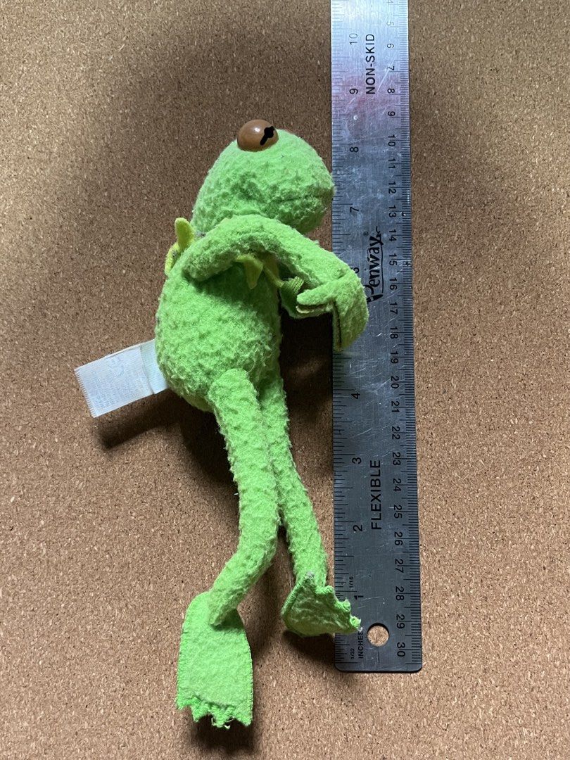 Kermit the Frog Plush (Category: Plushies & Soft Toys) located in Baguio. Submitted by gaara1234 (Listing ID 1467449021, Image 1). Description: - Item: Kermit the Frog plush toy - Size: Approximately 7.5 inches long - Details: Classic green felt material, long skinny limbs, and button eyes - Condition: Clean fabric overall with original tag still attached - Perfect for collectors, kids, or as a cute desk display.