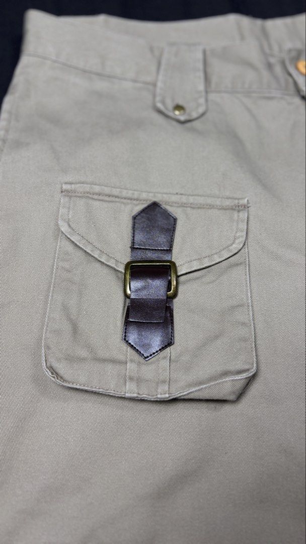 Khaki Multi-Pocket Cargo Pants with Cinch Cuffs (Category: Jeans) located in Bacoor. Submitted by calvinmanzano13 (Listing ID 1467387188, Image 3). Description: - L = 40” | W = 35” - No brand or tags - Material: Sturdy cotton twill - Pockets: Multiple utility pockets with secure zippers and snap buttons - Unique Details: Front right pocket with a distinct buckle strap Notes: 🔥 Hand washed 🔥 Polished 🔥 Steam ironed.