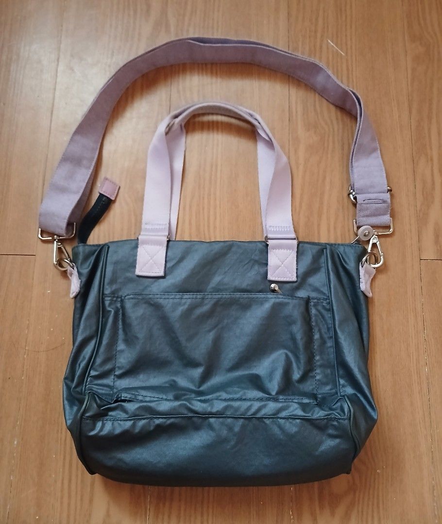 Kipling KI3152-K77 Tote Shoulder Bag (Category: Tote Bags) located in Daraga. Submitted by thethriftcity2024 (Listing ID 1467436913, Image 2). Description: - Authentic Kipling tote bag (Style: KI3152-K77 1020/20553, Made in Vietnam) - Colorway: Dark grey body with pale pink dual top handles and a purple crossbody strap - Storage: Front zippered pocket, interior zipped compartment, and handy slip pockets - Interior: Fully lined with the signature 
