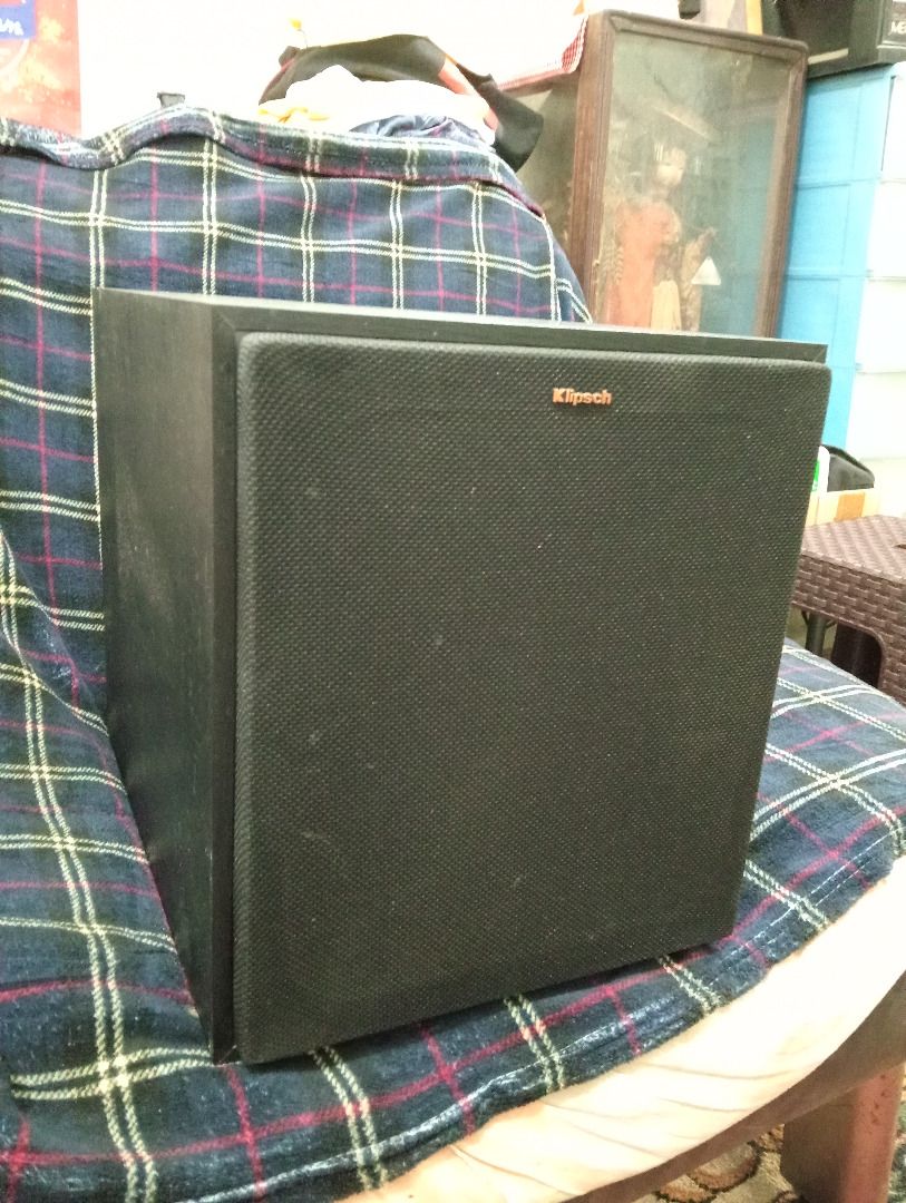 Klipsch Powered Subwoofer (Category: Soundbars, Speakers & Amplifiers) located in Marikina City. Submitted by manilabynight (Listing ID 1467598555, Image 1). Description: - Brand: Klipsch Subwoofer - Color: Black with copper-spun front driver - Condition: Tested and powers up fine - Controls: Gain control, low pass dial, phase switch, and line-in RCA jacks - Design: Rear bass port and removable fabric grille with badge - Performance: Delivers dee
