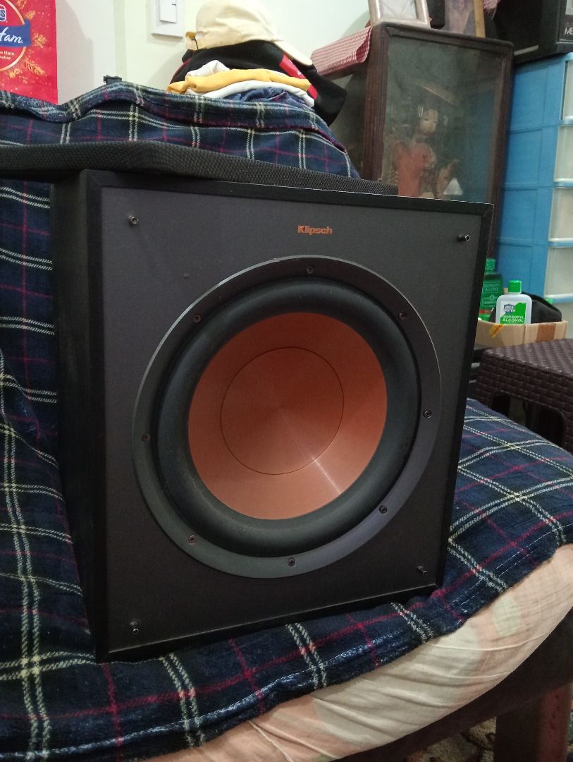 Klipsch Powered Subwoofer (Category: Soundbars, Speakers & Amplifiers) located in Marikina City. Submitted by manilabynight (Listing ID 1467598555, Image 2). Description: - Brand: Klipsch Subwoofer - Color: Black with copper-spun front driver - Condition: Tested and powers up fine - Controls: Gain control, low pass dial, phase switch, and line-in RCA jacks - Design: Rear bass port and removable fabric grille with badge - Performance: Delivers dee